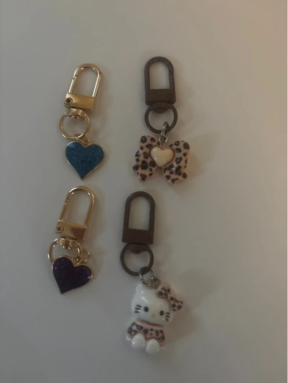 4 charms bows hello kitty and hearts